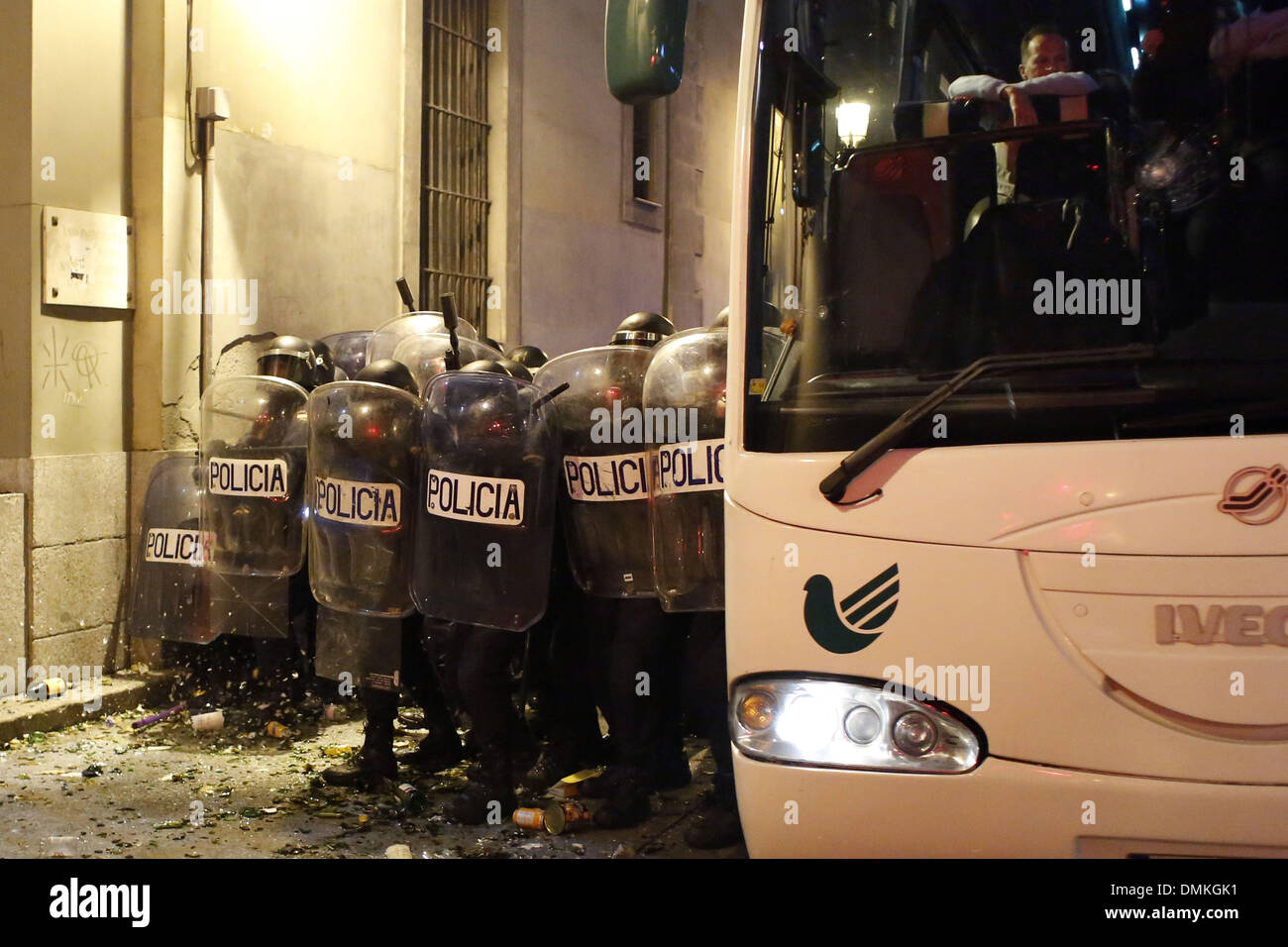 Madrid, Spain. 14th Dec, 2013. A bus with people inside waits in calle ...