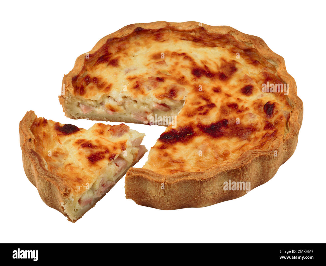Quiche with a portion cut out isolated against a white background Stock Photo