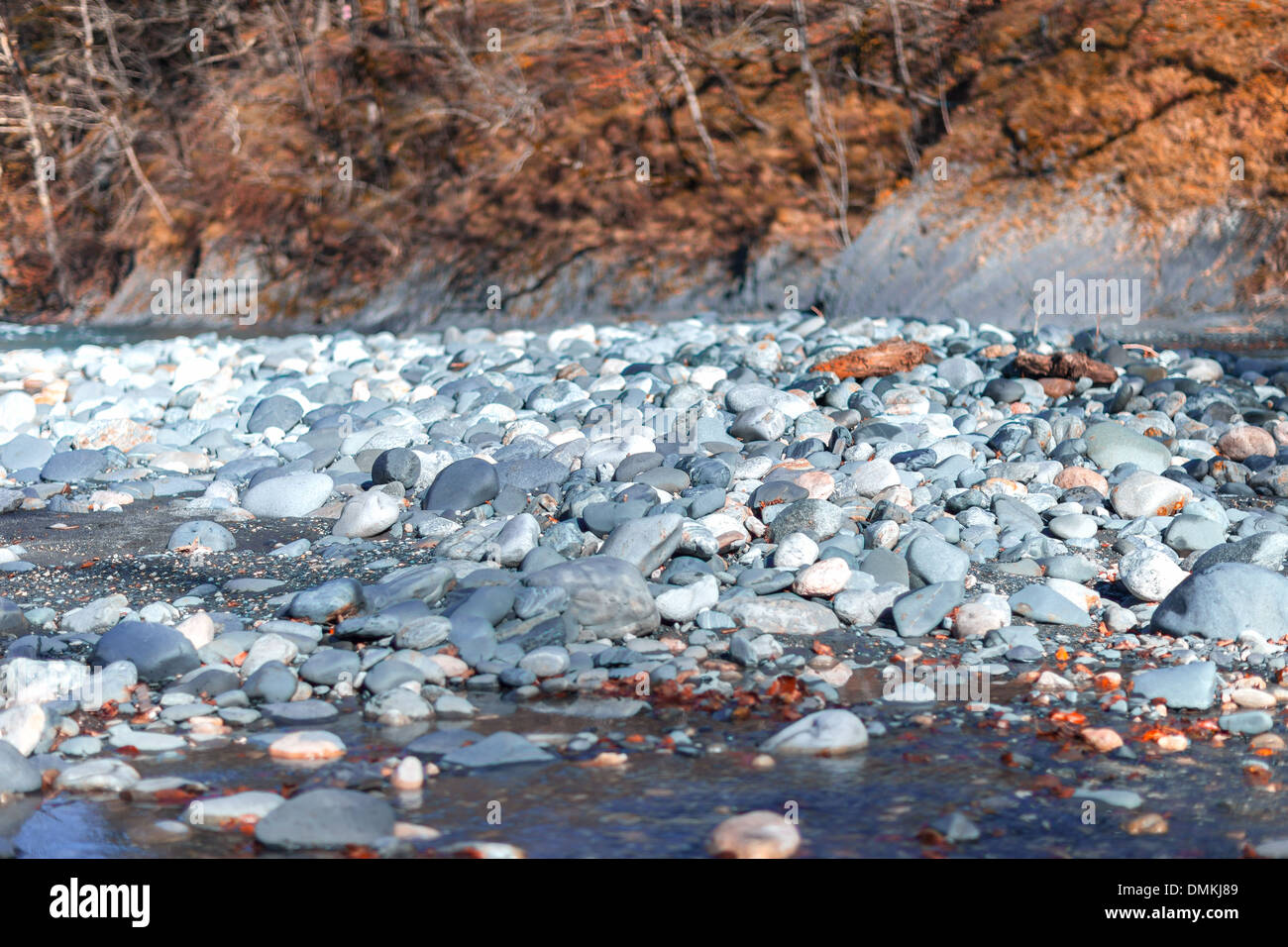 White stones in a mountain river on sunny day Stock Photo