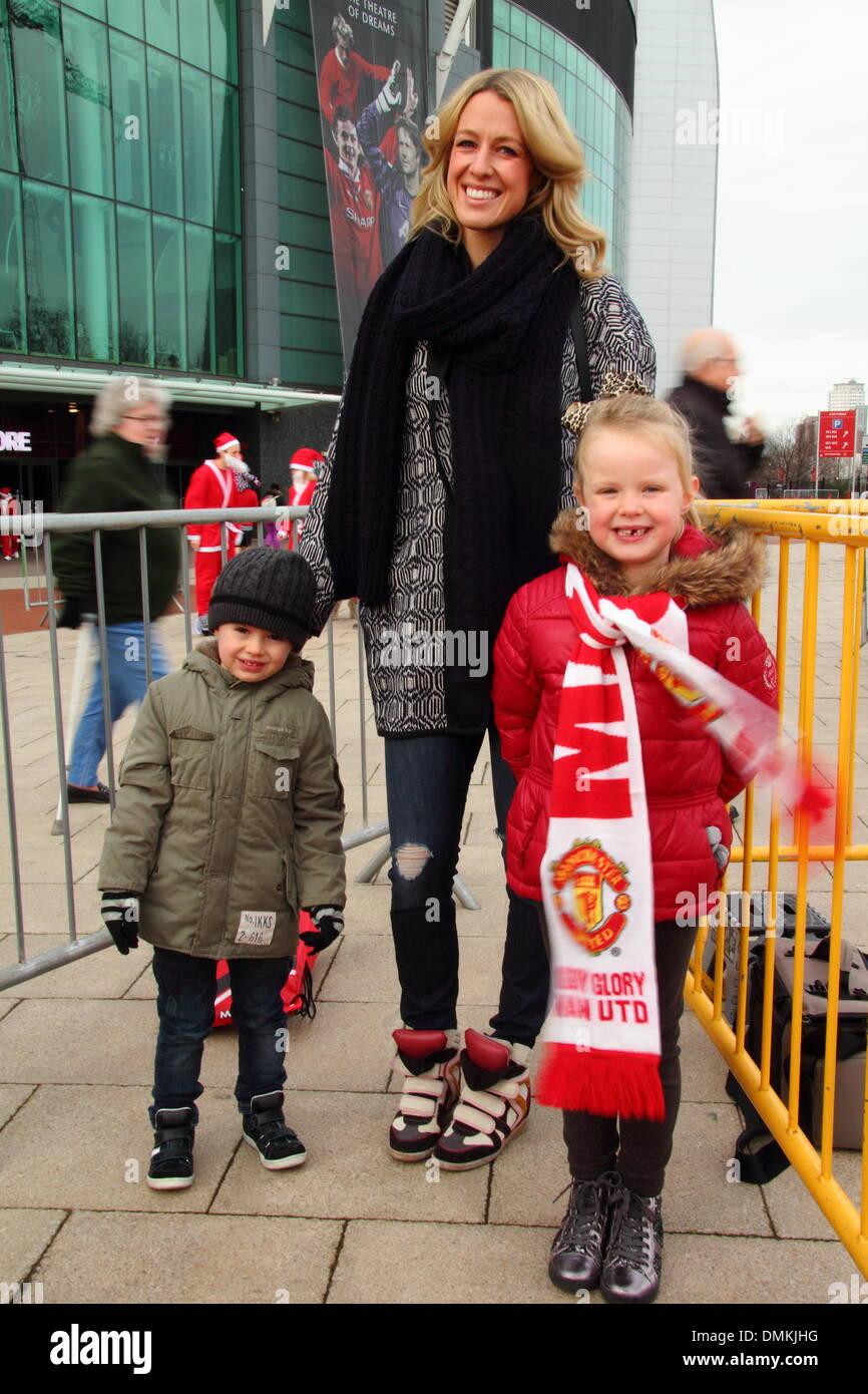 Old Trafford, Manchester, UK. 15th Dec 2013. Michael Carrick's wife, Lisa with son, Jacey and daughter, Louise. Manchester United footballer, Michael Carrick kicks off the seventh annual Manchester United Foundation Santa Run. The Santa Run is a charity event with participants raising money for the Foundation and its charity partners Francis House Children’s Hospice, The Christie and UNICEF, or another charity of a participant’s choice. A Manchester United Foundation spokeswoman said more than 1500 runners participated. Credit:  Deborah Vernon/Alamy Live News Stock Photo