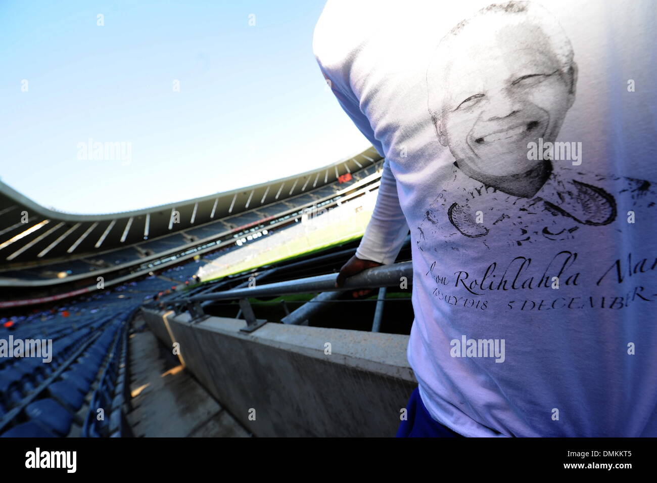 Soweto, South Africa. 15th Dec 2013. Thousands of people gathered to pay their last respects to Nelson Mandela at Orlando Stadium while he was buried in Qunu on December 15, 2013 in Soweto, South Africa. Nelson Mandela passed away on the evening of December 5, 2013 at his home. He is laid to rest at his homestead in Qunu today. (Photo by Gallo Images / Foto24 / Mary-Ann Palmer) Credit:  Gallo images/Alamy Live News Stock Photo