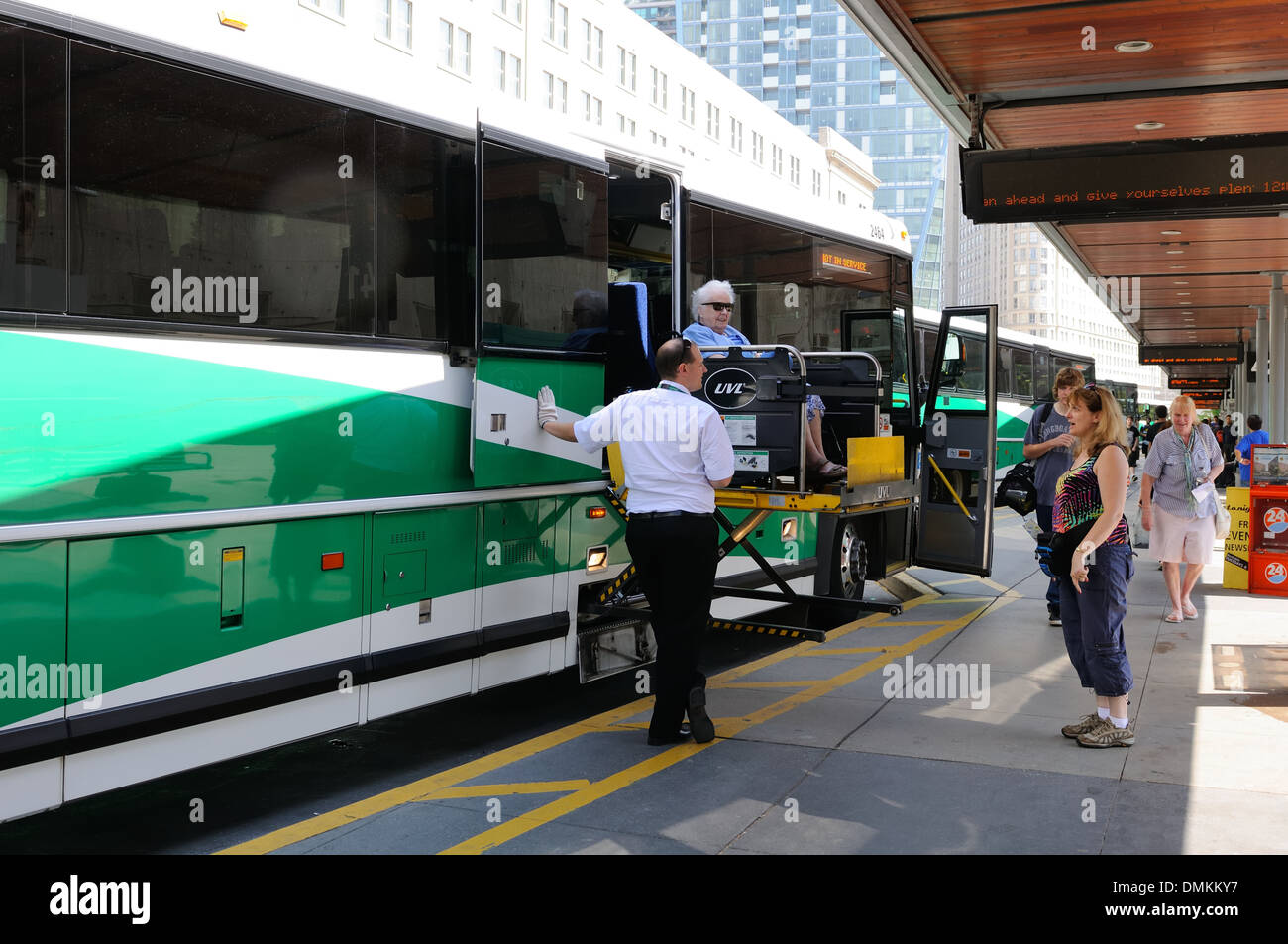 Wheelchair lift operated by a GO bus driver in Toronto, Ontario, Canada Stock Photo