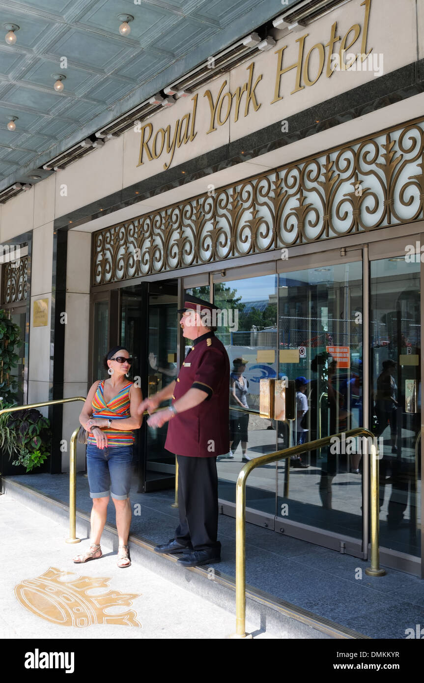 Hotel doorman and member of public at the Royal York Hotel, Toronto