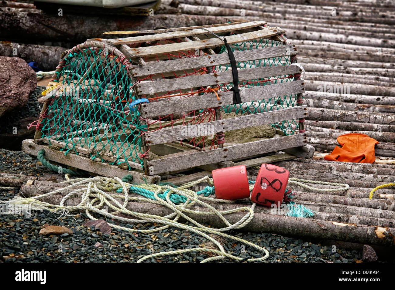 A wooden lobster trap with buoys and rope on a Newfoundland, Canada wharf  Stock Photo - Alamy