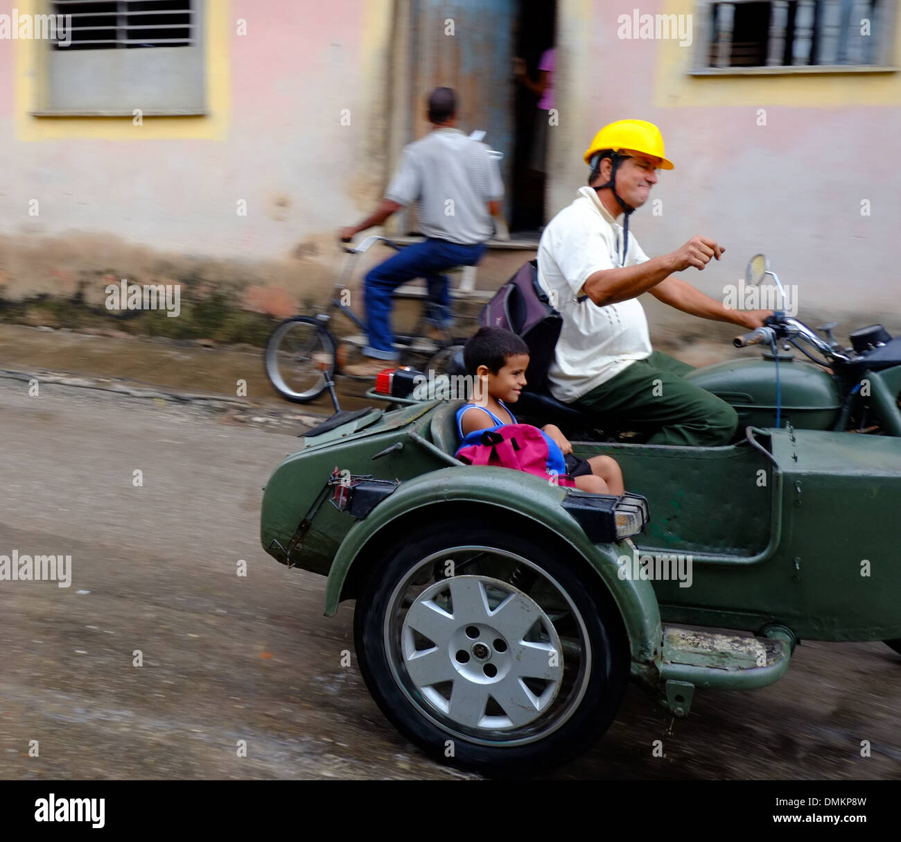 A Man On A Vintage Motorbike With A Child In The Sidecar On The Street In Trinidad Cuba Stock Photo Alamy