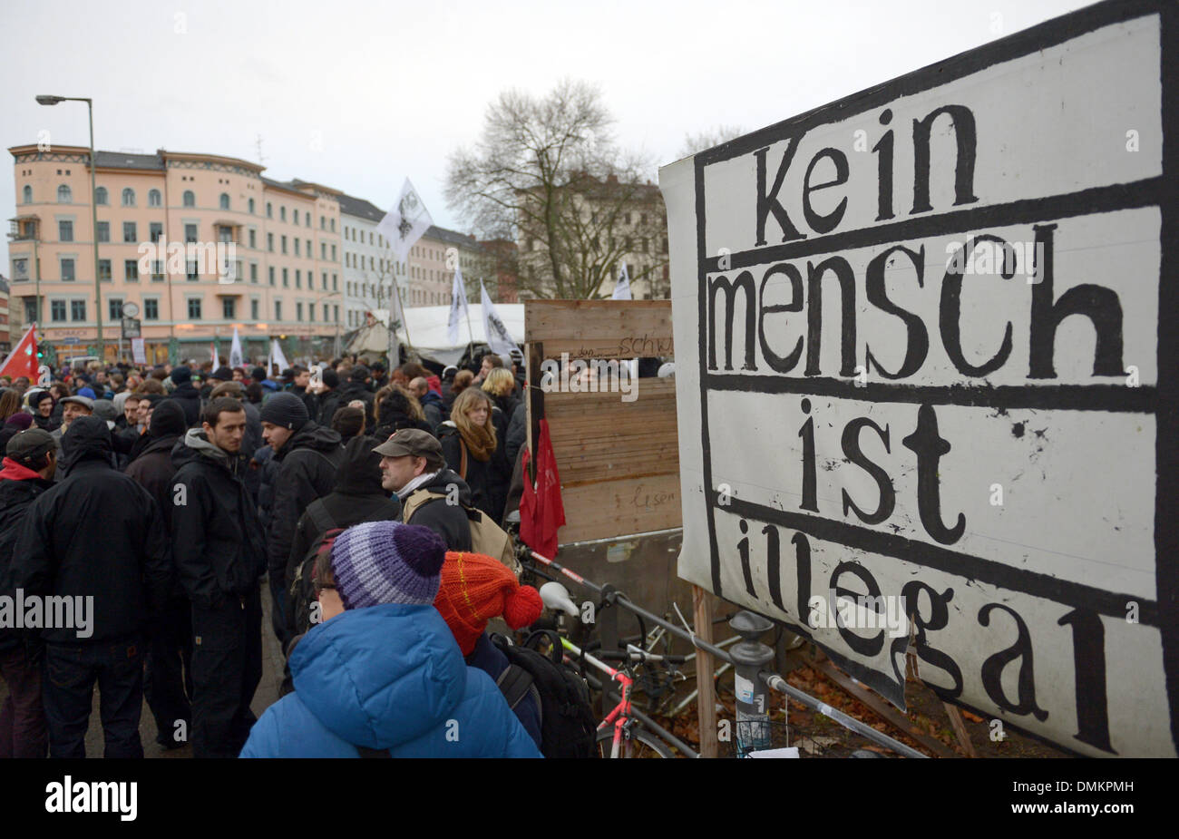 Berlin, Germany. 15th Dec, 2013. 'No one is illegal' (lit.) stands on a