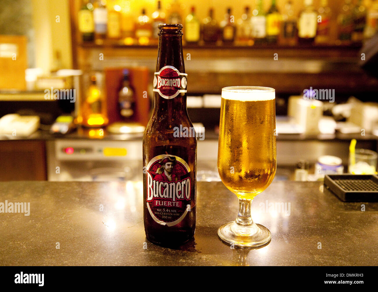 Bucanero bottled beer and glass on a bar, local Cuban beer, Havana