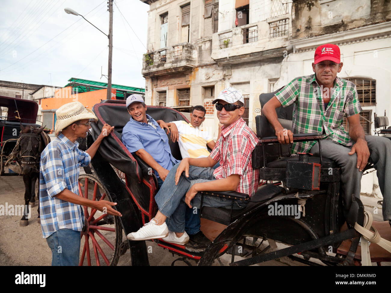 Cuban horse and carriage drivers relaxing before a days work on their carriage, Havana, Cuba, Caribbean, Latin America Stock Photo