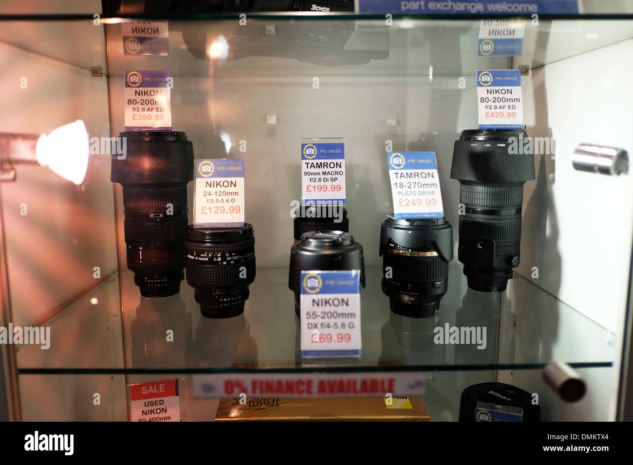 Nikon Tamron camera lens display in shop new cameras for sale