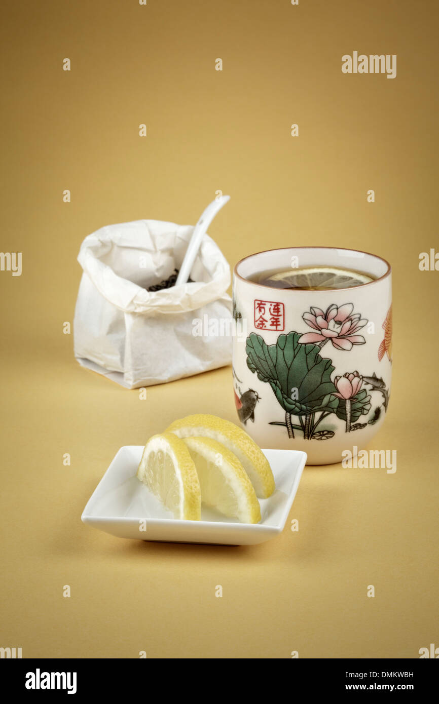 Cup of green tea with fresh lemon slices Stock Photo Alamy