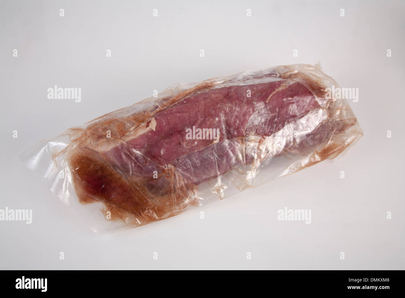 Meat products beef cow pork chicken pieces slice portions frozen presented on ice Stock Photo
