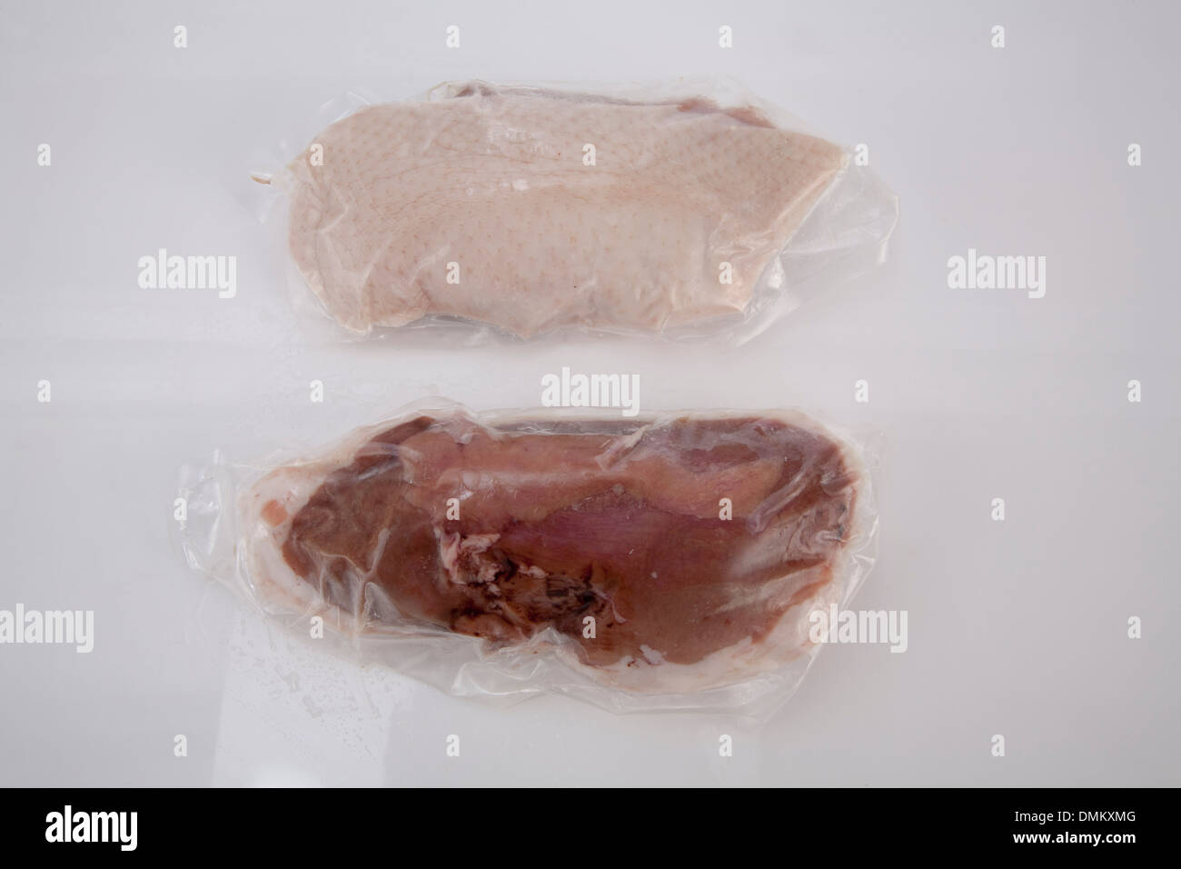 Meat products beef cow pork chicken pieces slice portions frozen presented on ice Stock Photo