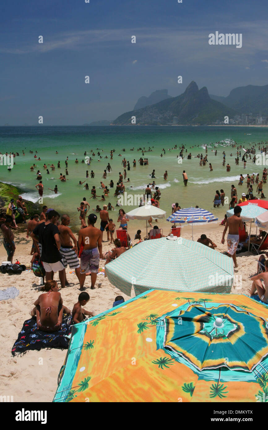 Sunbathers enjoy Arpoador Beach in a sunny spring afternoon. Rio de
