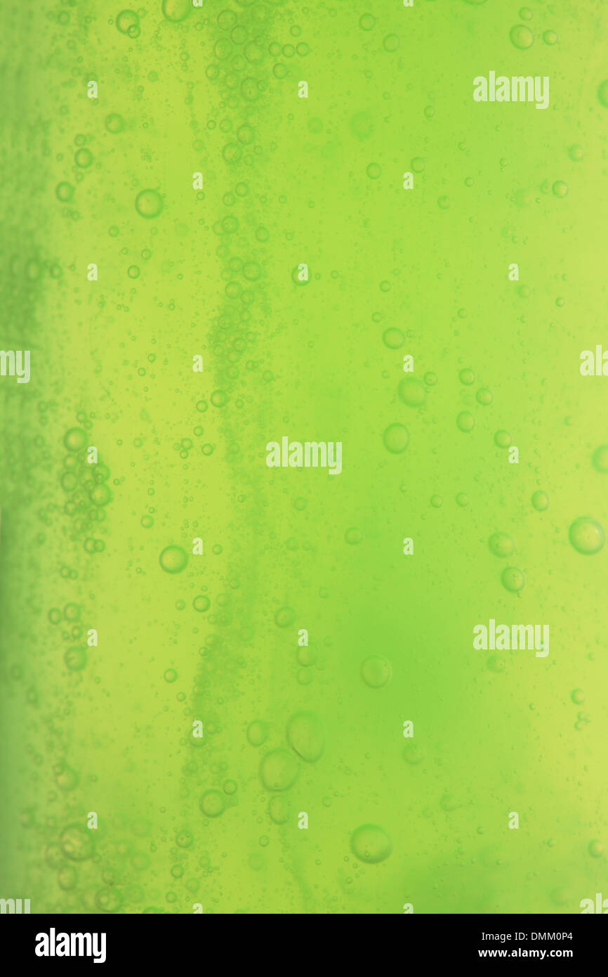 Green abstract blurred liquid background with soap bubbles Stock Photo ...