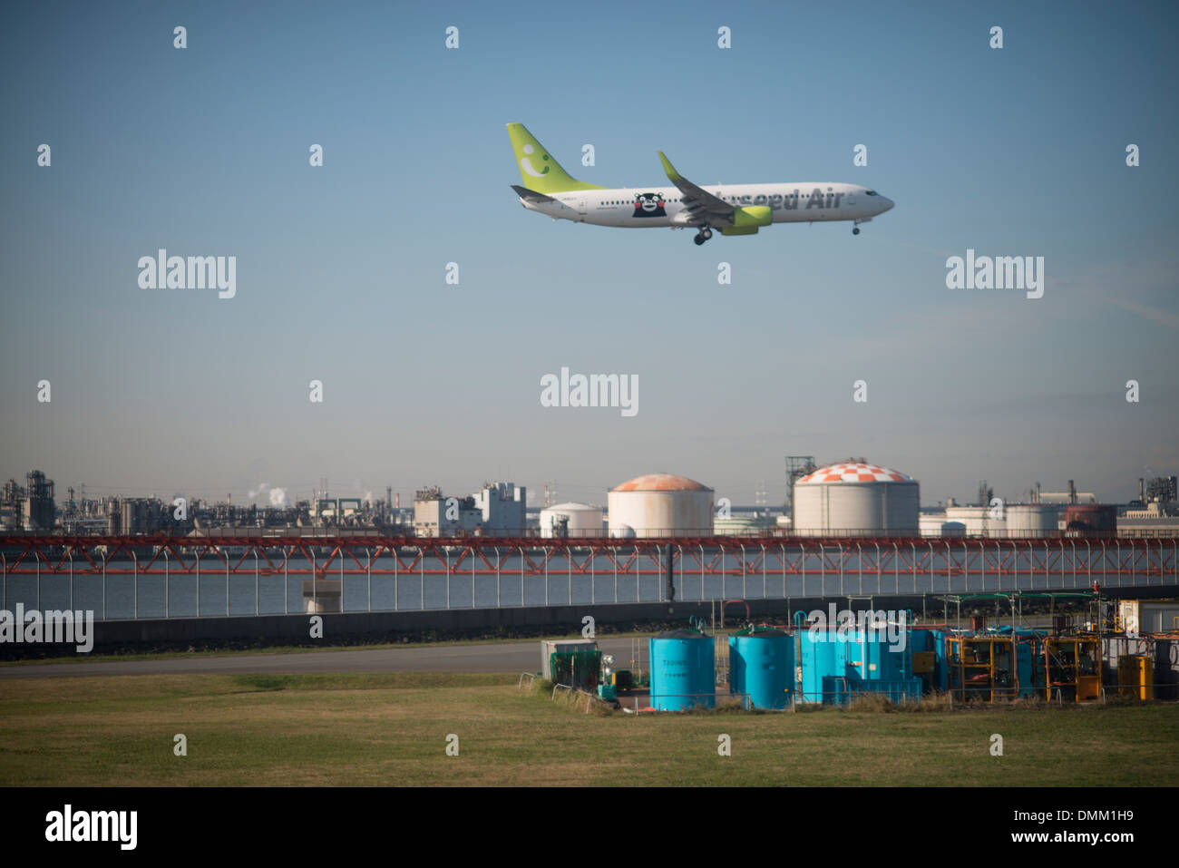 A plane comes into land at Tokyo International Airport or Haneda