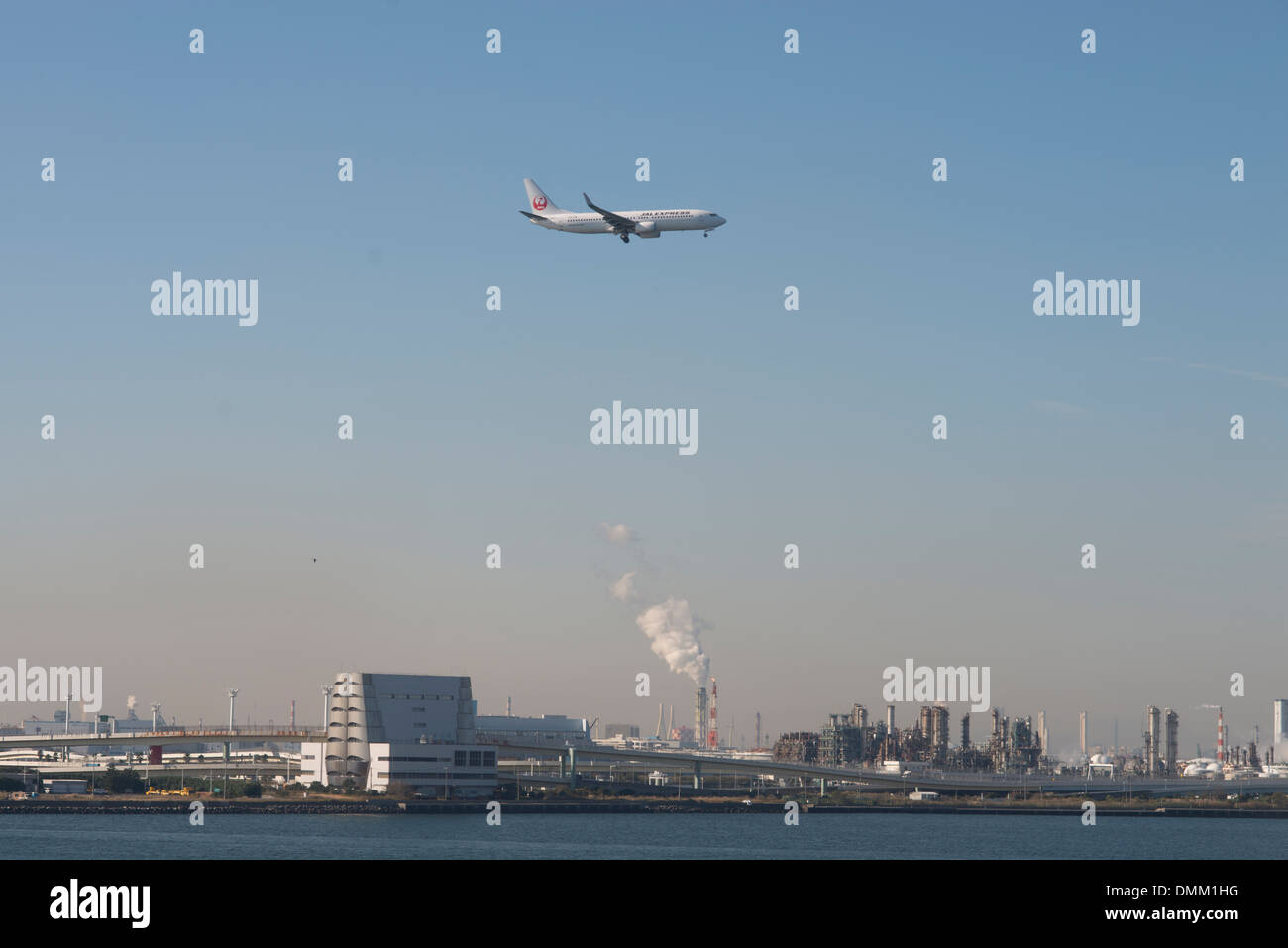 A plane comes into land at Tokyo International Airport or Haneda