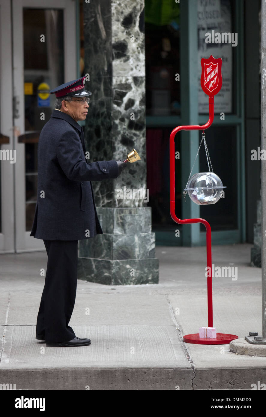 Salvation Army member in downtown Toronto, December 24 2012 Stock Photo