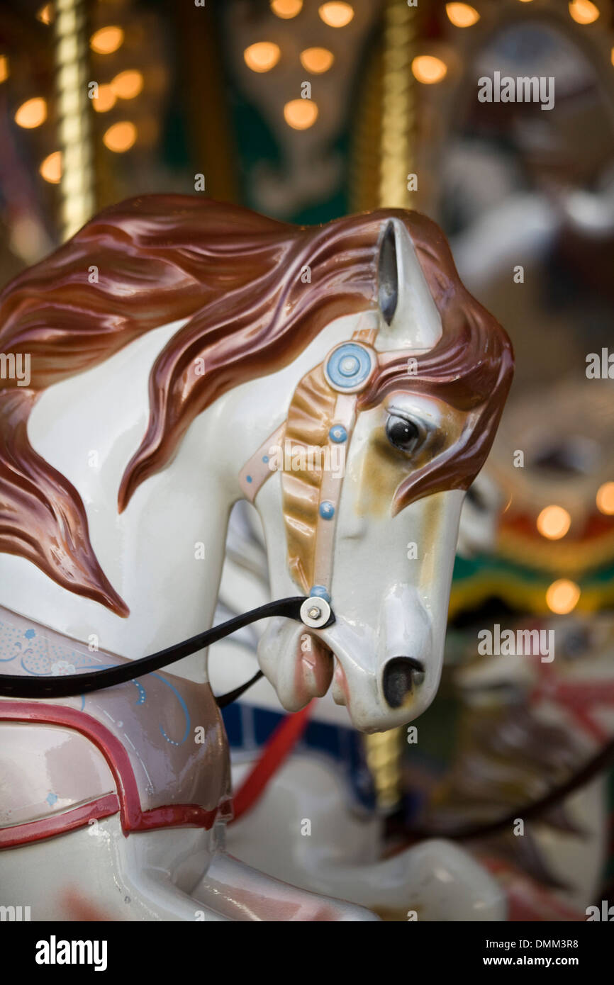 Traditional fairground galloping horses ride Stock Photo
