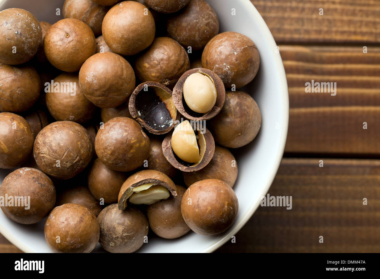top view of macadamia nuts in ceramic bowl Stock Photo
