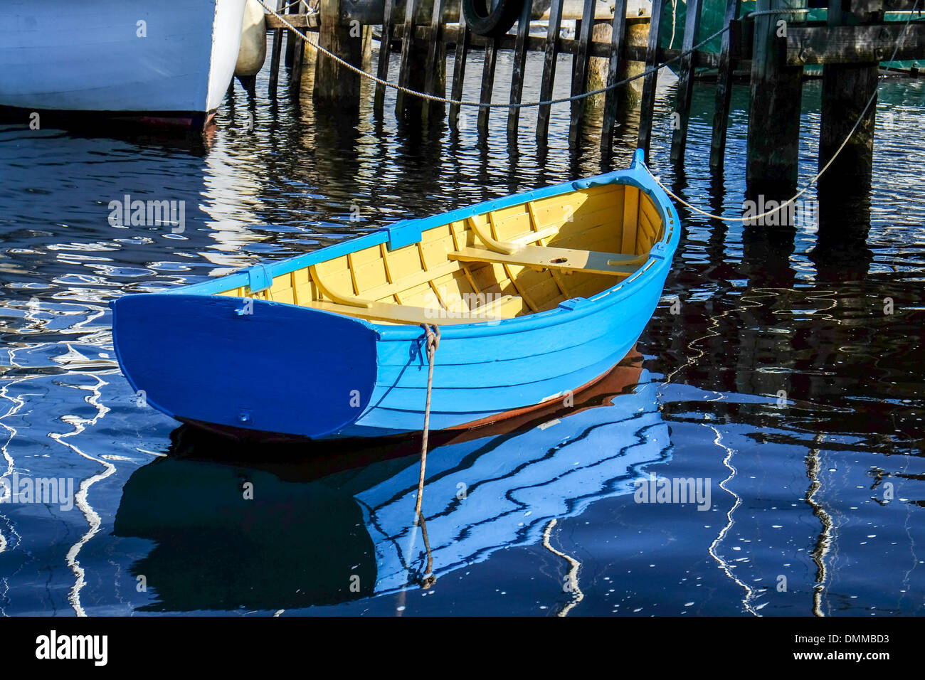 A blue painted traditional wooden dinghy moored at the Wooden Boat School at Franklin in Tasmania's Huon Valley Stock Photo