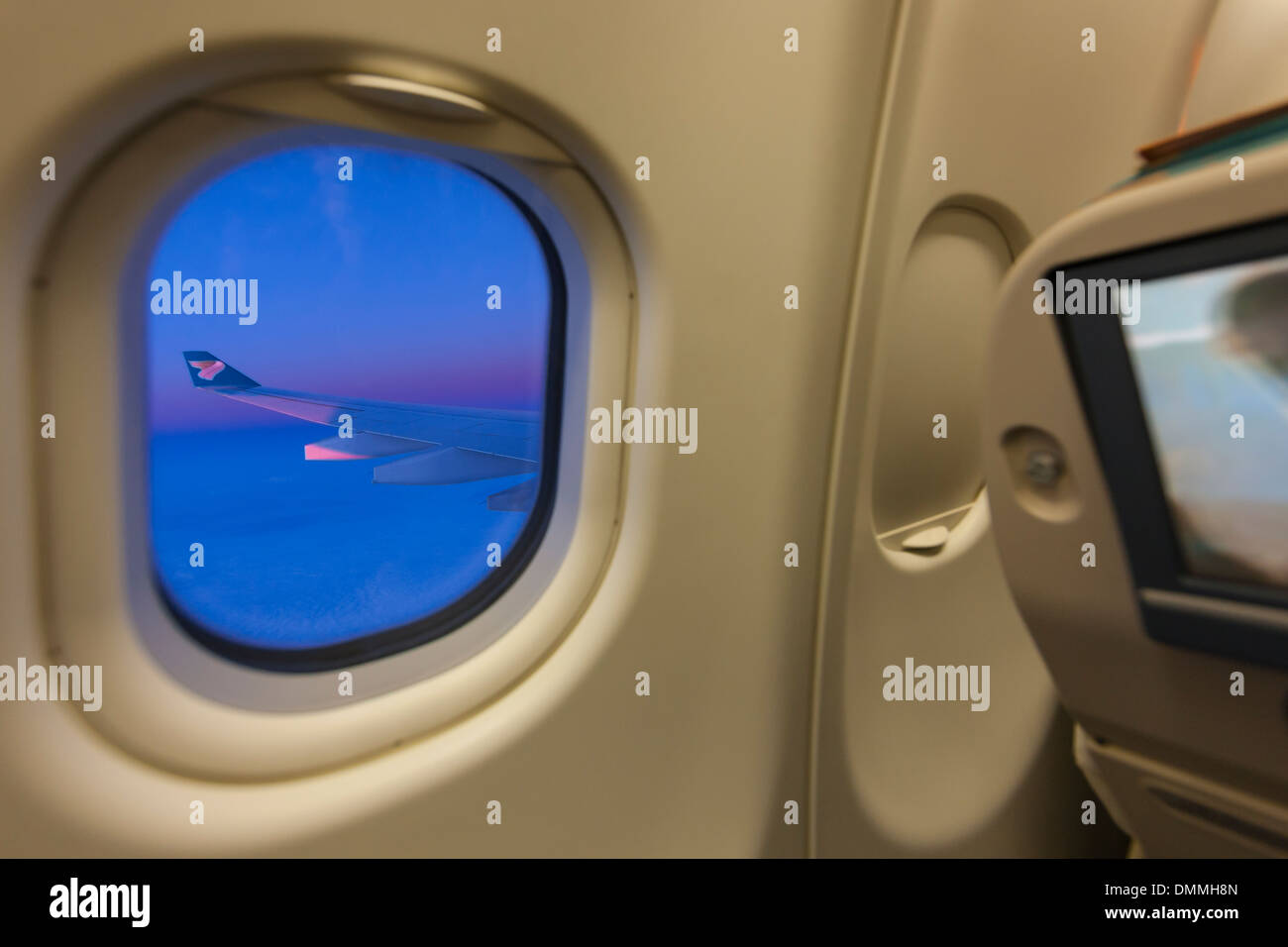 View of airplane wing through window Stock Photo