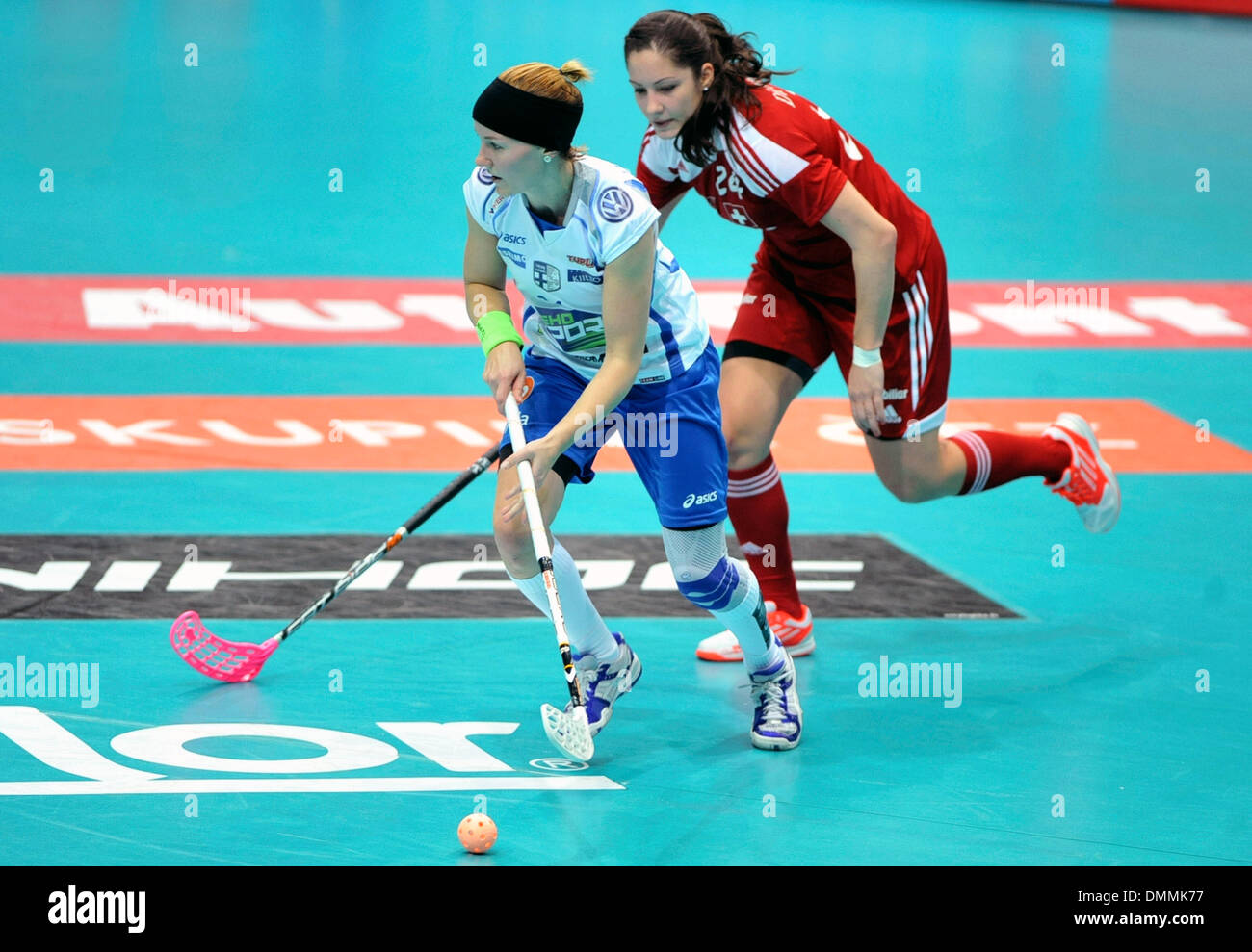 Ostrava, Czech Rep. 14th Dec, 2013. Katri Luomaniemi, left, of Finland  fights for the ball with Flurina Marti, right, of Switzerland during their  Women's Floorball World Championship semifinal match in Ostrava, Czech