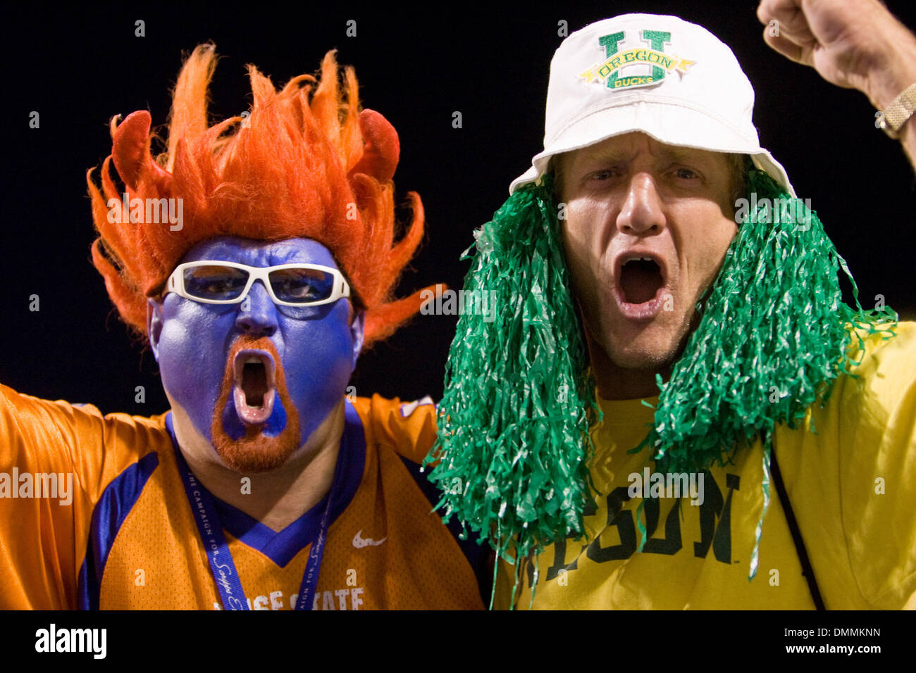 03 September 2009: A Boise State and an Oregon fan both cheering for their team during first half action of the Boise State - Oregon football  game. The Boise State Broncos defeated the Oregon Ducks 18-9 at Bronco Stadium in Boise ID. (Credit Image: © Southcreek Global/ZUMApress.com) Stock Photo