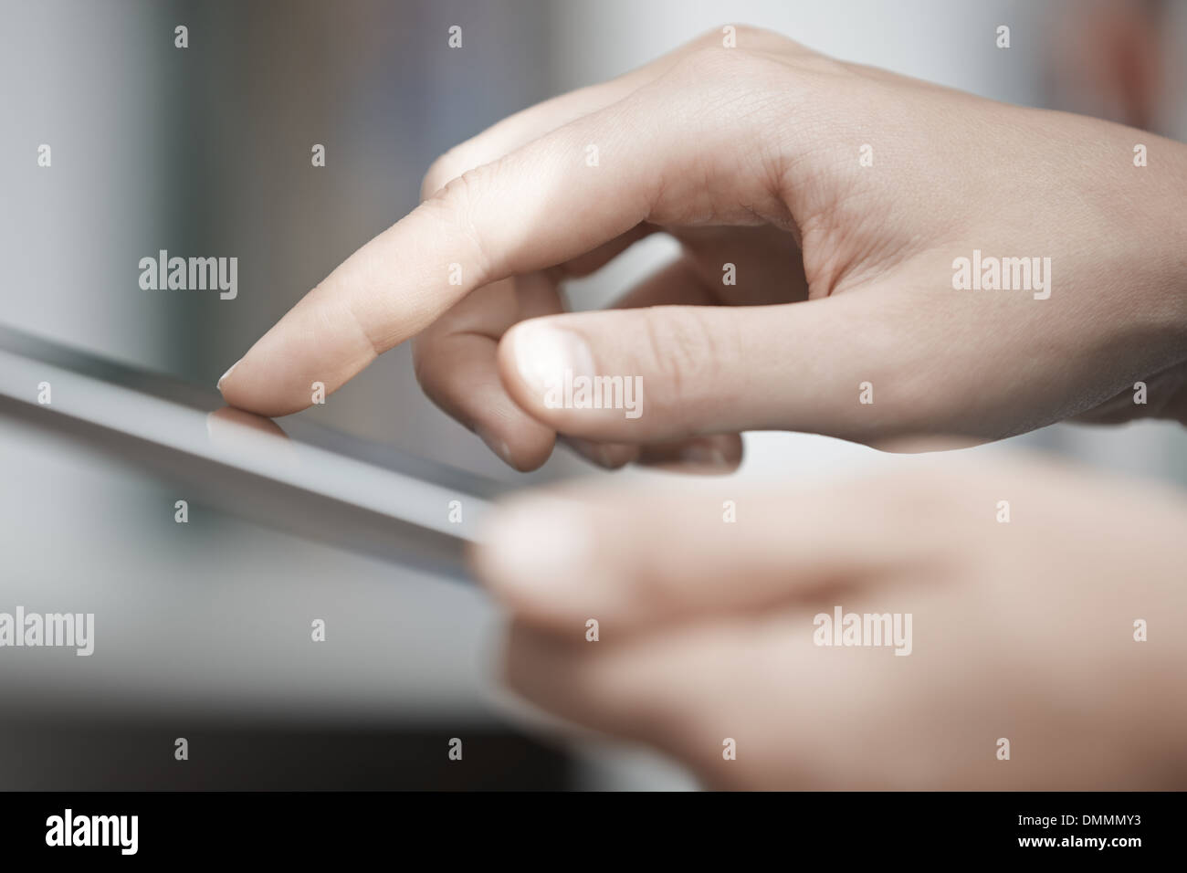 Close-up view on the human hands using digital tablet Stock Photo
