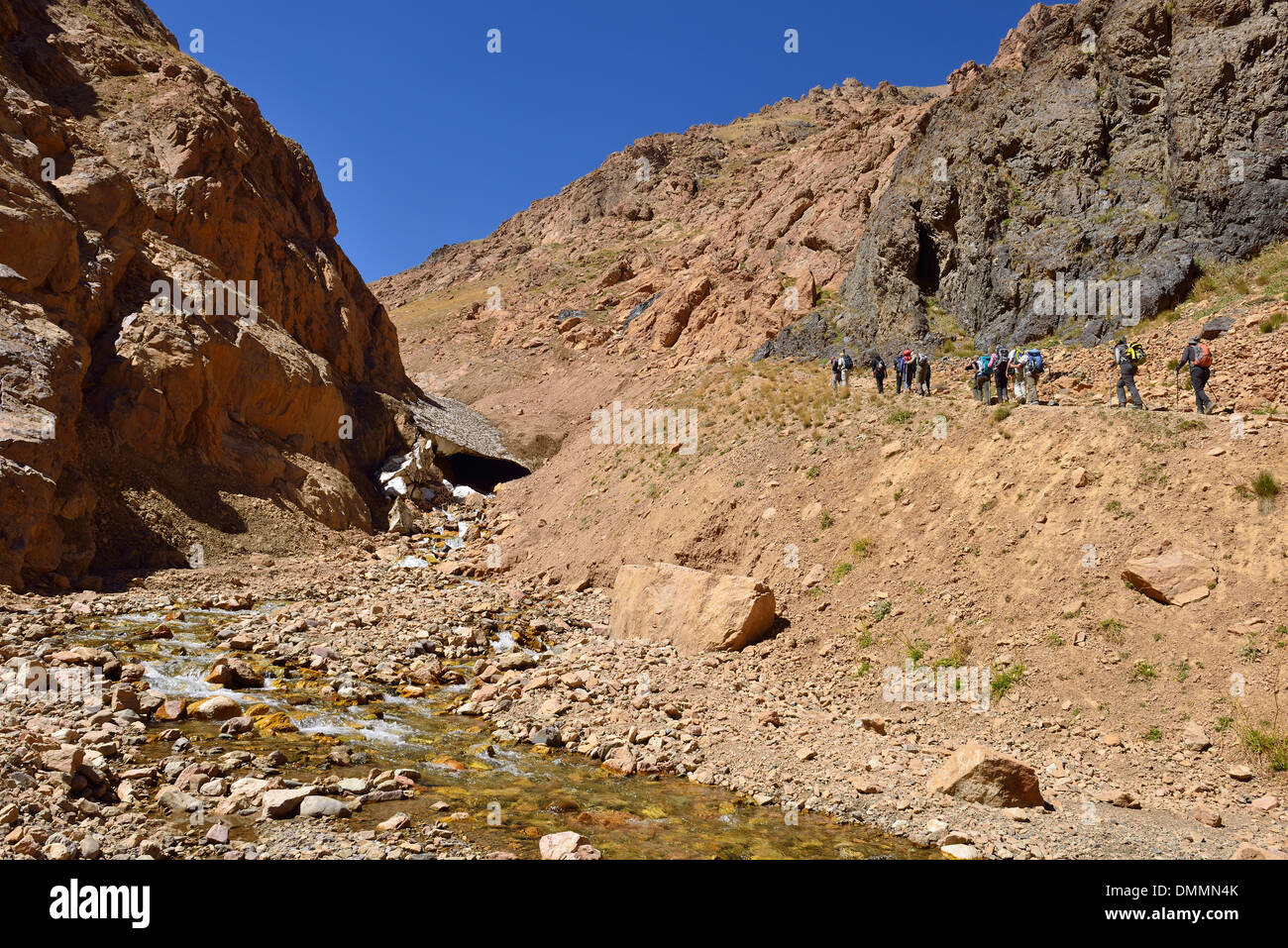 Iran, group of people hiking in Khoram Dasht valley, Alam Kuh area, Alborz mountains Stock Photo