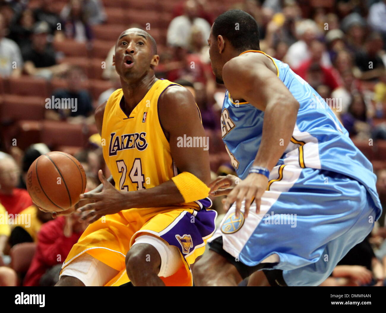 Kobe Bryant dribbles while chewing his jersey as he is defended by News  Photo - Getty Images