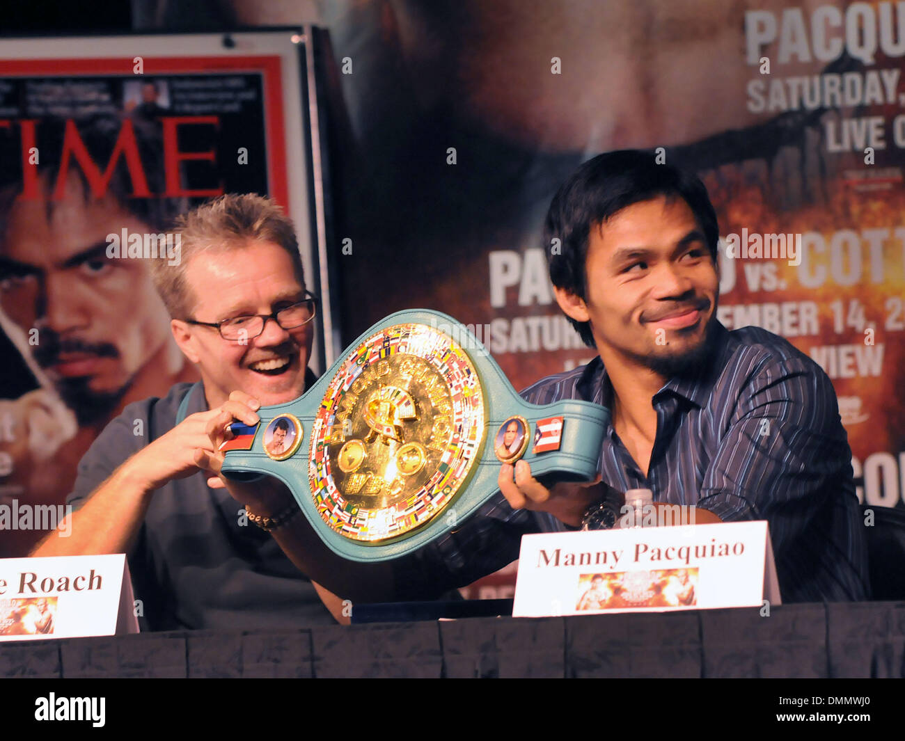 Nov 11, 2009 - Las Vegas, Nevada, USA - Boxer MANNY PACQUIAO, right, with trainer, FREDDIE ROACH hold up the Diamond Belt, during the final news conference at the MGM Grand before Pacquiao's  WBO welterweight championship bout against  Miguel Cotto on Saturday, Nov. 14, 2009 at the MGM Grand Garden Arena. (Credit Image: © David Becker/ZUMApress.com) Stock Photo