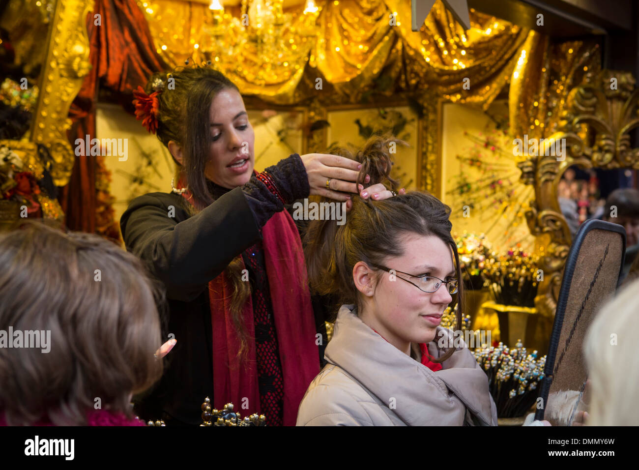 Christmas Market Cologne Woman making a hairstyling Stock Photo