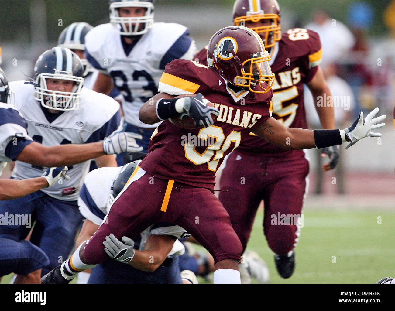 SPORTS Indian runner Trenton Miller picks his way through an opening as