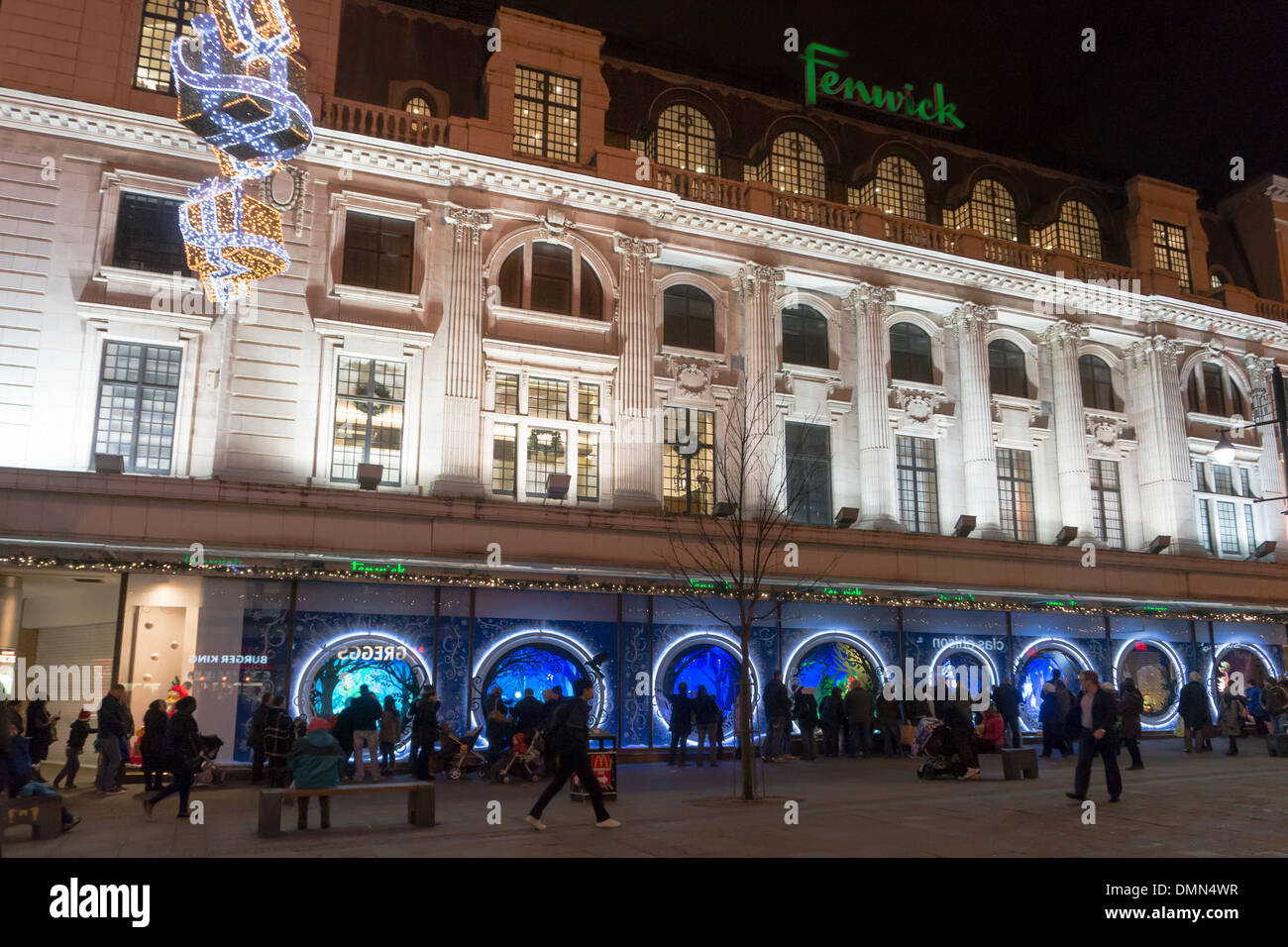 Families looking into Fenwick's shop windows, Christmas display