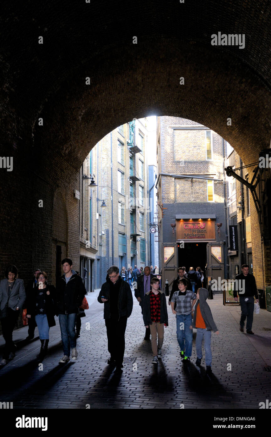 London, England, UK. Clink Street, SE1. Arch leading through to Clink Prison Museum Stock Photo