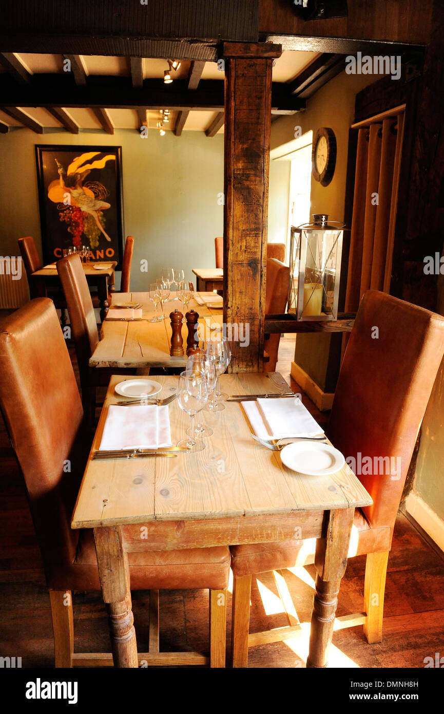 Tables laid out in a traditional English Pub restaurant. Stock Photo