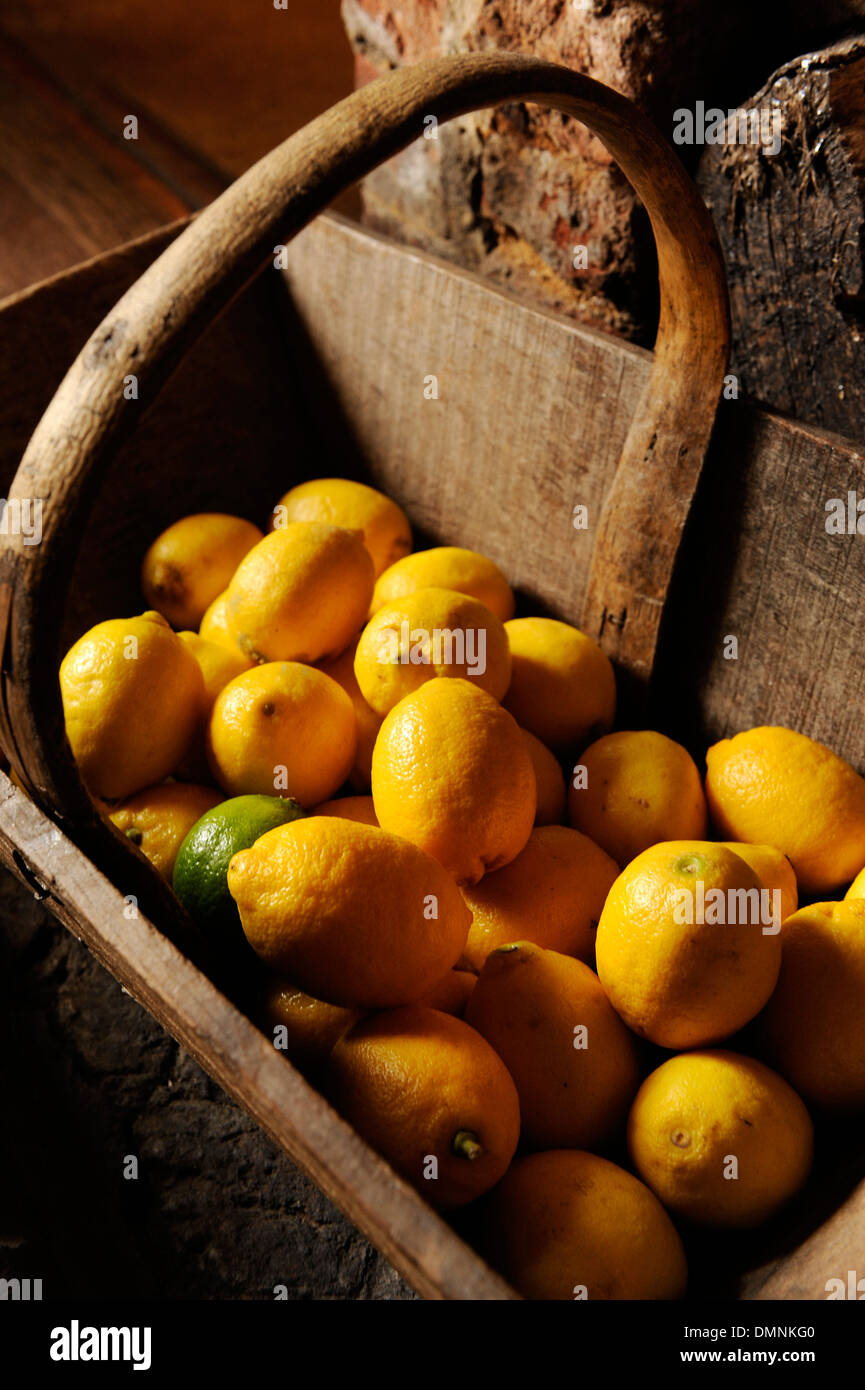 Lemons in a wooden carrier Stock Photo