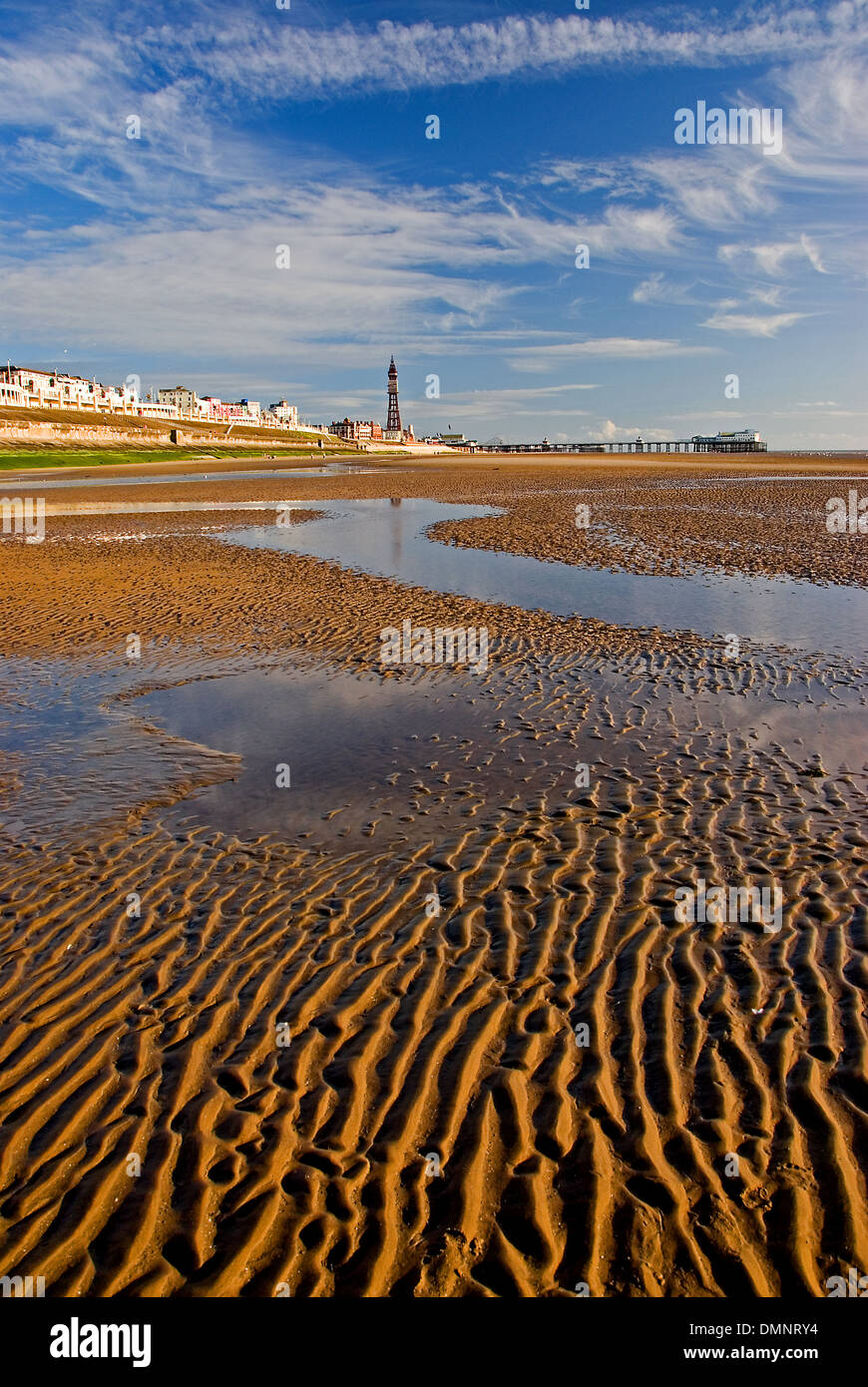 Low tide in the Irish Sea exposes vast areas of rippling sandy beaches along Blackpool's seafront. Stock Photo