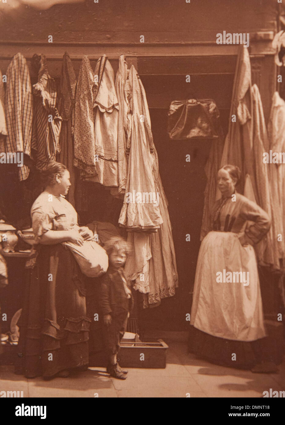 Photograph showing 'An old clothes shop, Seven Dials' in the Street Life in London book Stock Photo