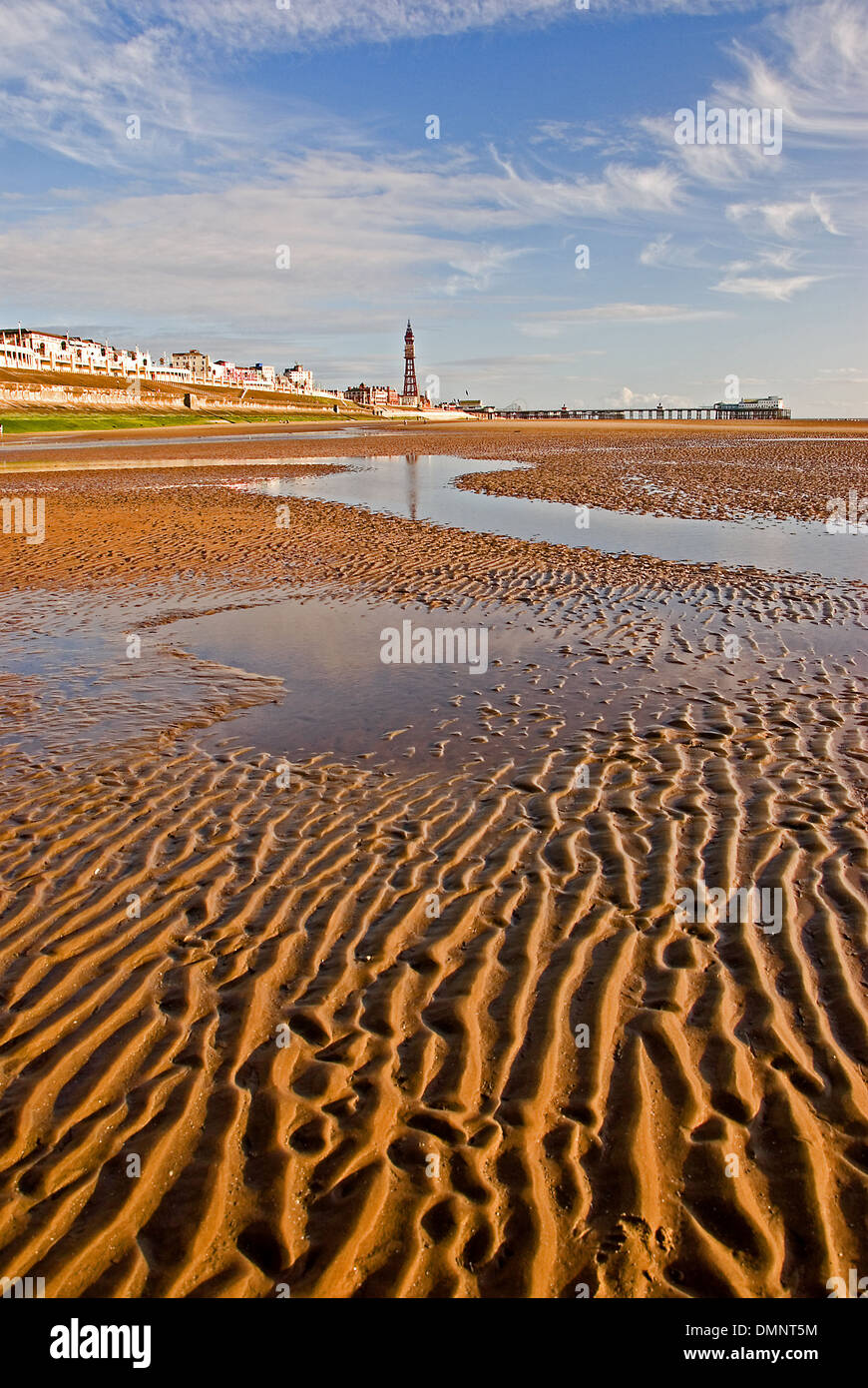 Low tide in the Irish Sea exposes vast areas of rippling sandy beaches along Blackpool's seafront. Stock Photo