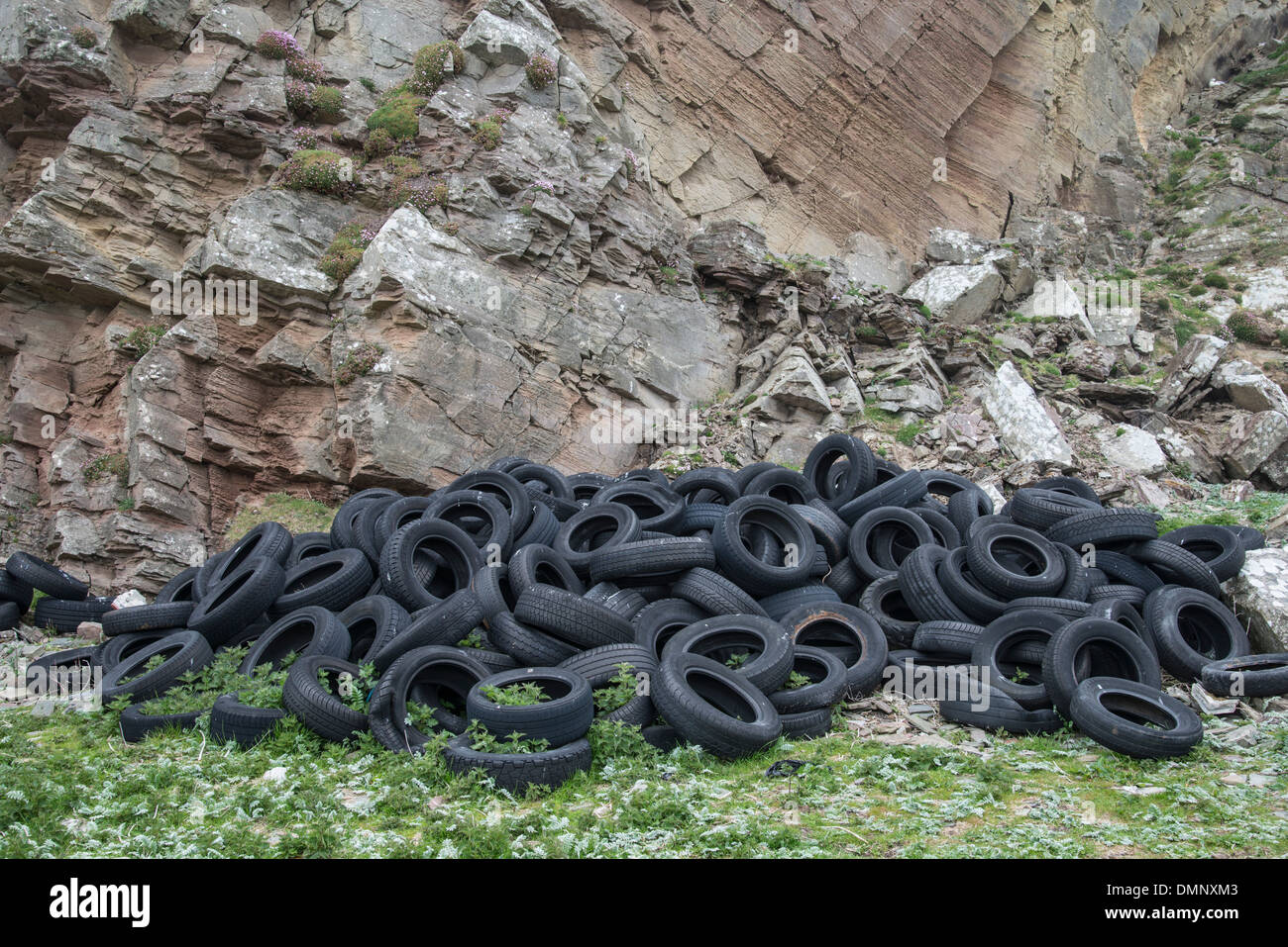 Old tyres dumped in quarry.Shetland, Scotland Stock Photo