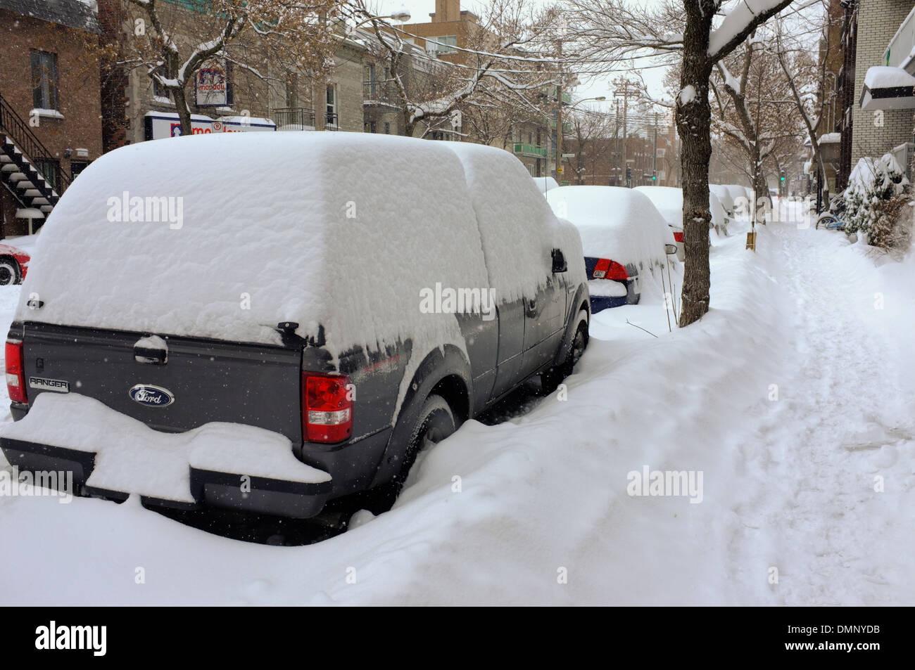 Automobiles covered in snow in Montreal, Quebec. Stock Photo