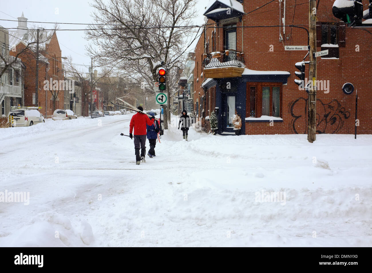 People walking through downtown Montreal with their cross country skis