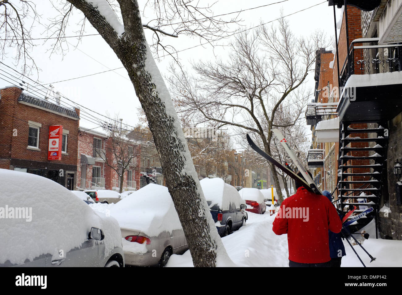 People walking through downtown Montreal with their cross country skis