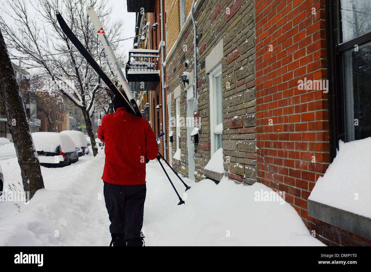 People walking through downtown Montreal with their cross country skis