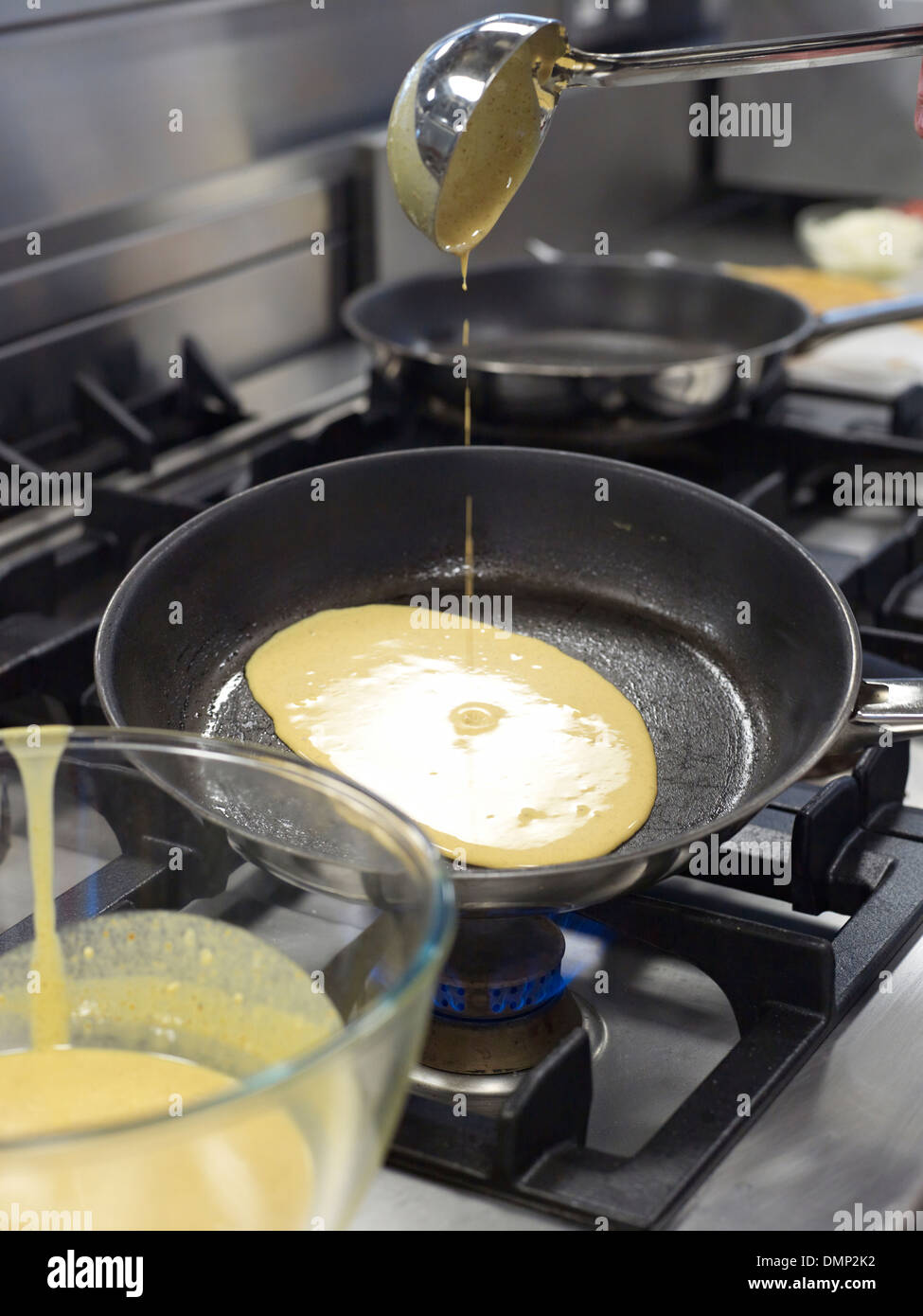 pancake mix mixture frying pan fry kitchen gas Stock Photo Alamy