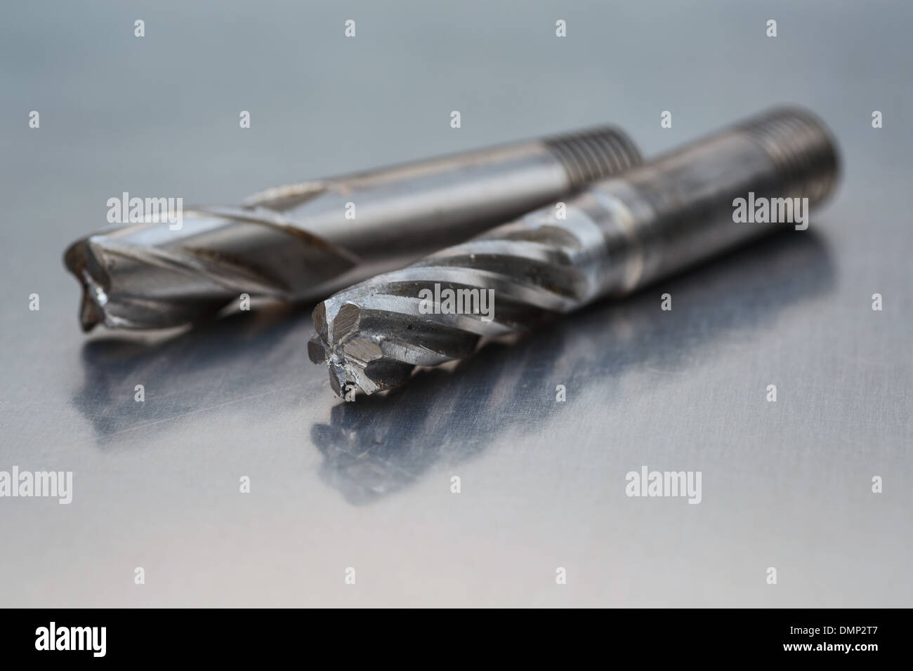 Two milling machine cutters on a metal work bench Stock Photo Alamy