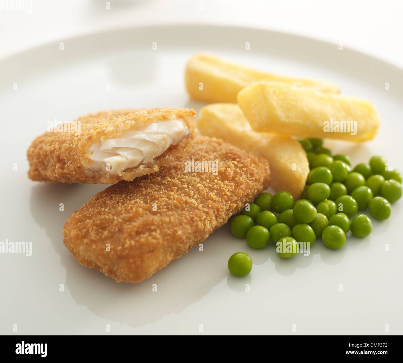 beer battered fish pieces chips peas Stock Photo