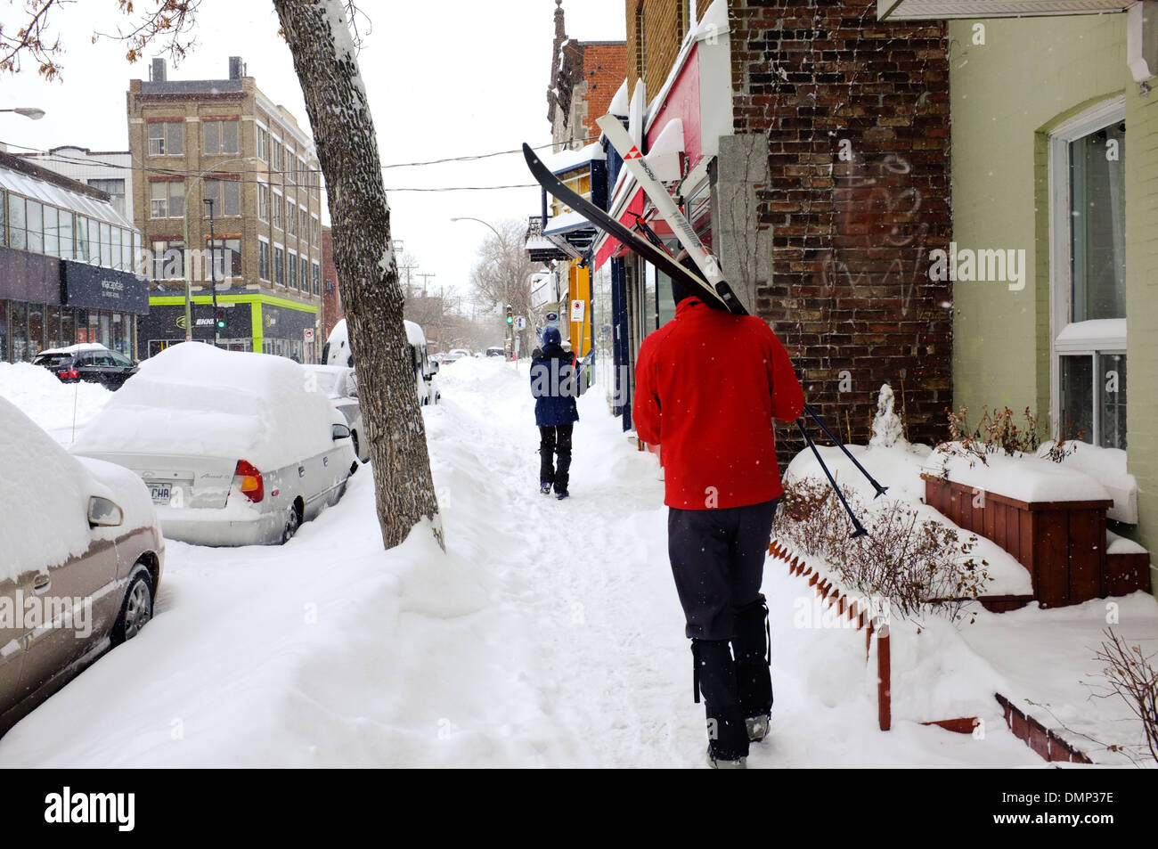 People walking through downtown Montreal with their cross country skis