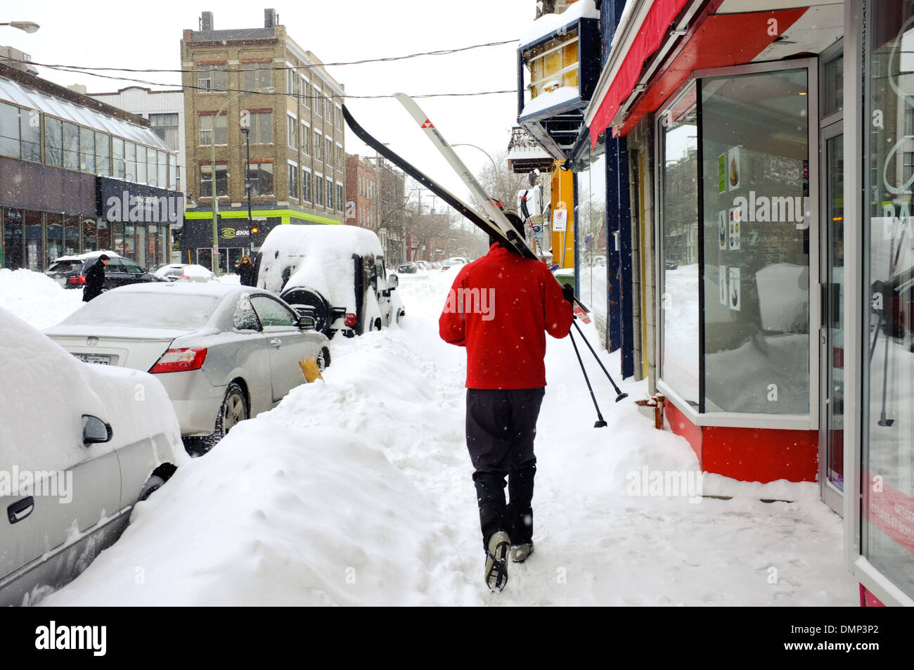 People walking through downtown Montreal with their cross country skis